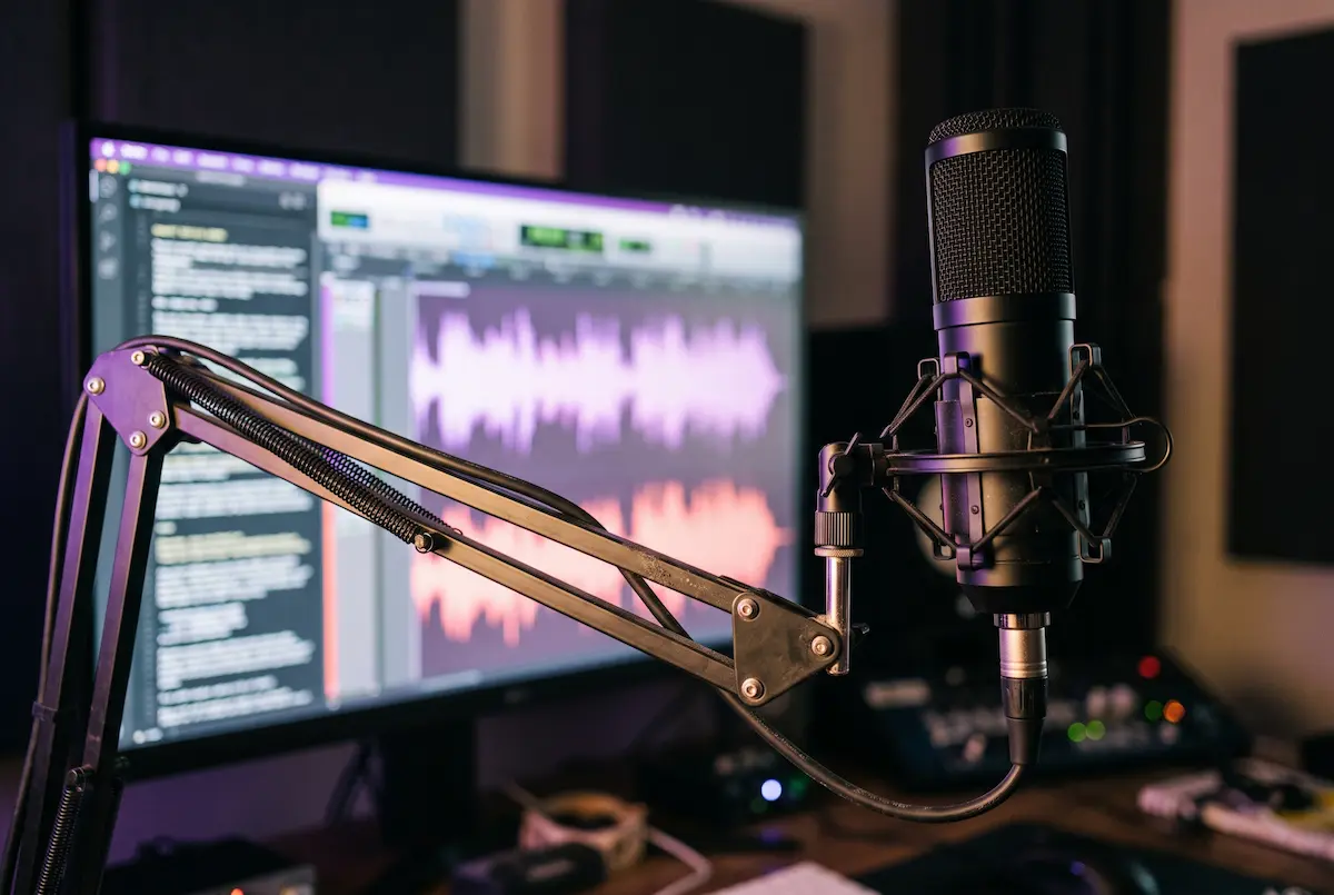 Studio microphone with a glowing digital sound waveform representing AI voice generators